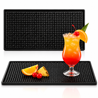Two black bar mats with a tropical cocktail and orange slices