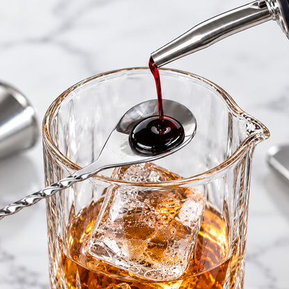 Layering a ruby syrup over the back of the bar spoon into a mixing glass