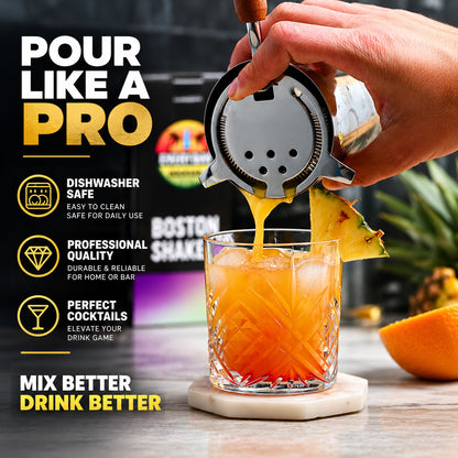 Pouring a cocktail through a strainer from the Everyday Cocktail Boston shaker